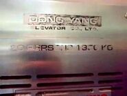 Dong Yang elevator capacity badge.