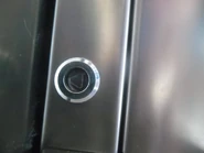 Fermator's door component triangle-shaped door keyhole on Schindler 3300