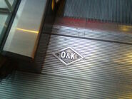 O&K logo on one of the O&K escalators at Melbourne Central Shopping Centre in Melbourne, Australia.