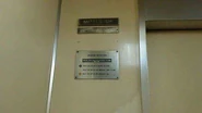 Early 1970s Mitsubishi nameplate in Jakarta, Indonesia. Below the nameplate is the rated load and operating instruction plate. The elevator has since been modernized in the 2000s.