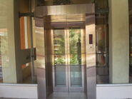 Full-sized glass door (with frames) elevator.