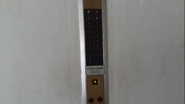 1990s surface mounted Toshiba hall station with analog floor indicator (for two elevators).