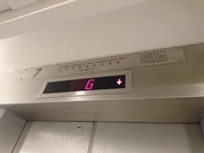 Otis elevator landing doors with triangle-shaped door keyhole to apply the standardized requirement in Hong Kong, China.