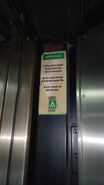 Atlas warning sticker telling passengers not to leave the car and wait for rescue in case of entrapment. Green logo is very rare.