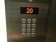 A modern Mitsubishi elevator with keypad-style floor buttons. The star button is used to selects the main/exit floor while the B button is used to select basement floor.