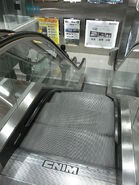 A CNIM escalator in Hong Kong with the newer 1990s logo on the landing plate. the escalator in this photo already extincted as the escalators being modernized by Kone in 2017[1].