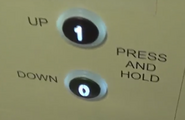 US97-EN buttons on a Stannah Platfrom lift (Photo: The ALEX ELLIS Channel)