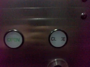 Hitachi door control buttons (1980s). Notice that they are letterings instead of symbols.