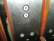 1993 Mitsubishi buttons with custom floor numbering, used in an early 1990s hydraulic elevator.