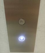 Dewhurst US91-15 call buttons with white illumination in Jakarta, Indonesia. These are used in a Schindler 5500 elevator.