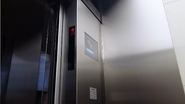 A mechanical door bumper frame with built-in sensor (CEDES sensors inside) on a Hitachi elevator.