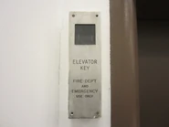 Elevator drop key emergency holder.