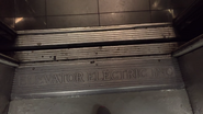 Elevator Electric door sill on an elevator from c. 1960 (logo is on the outside) (center opening doors)