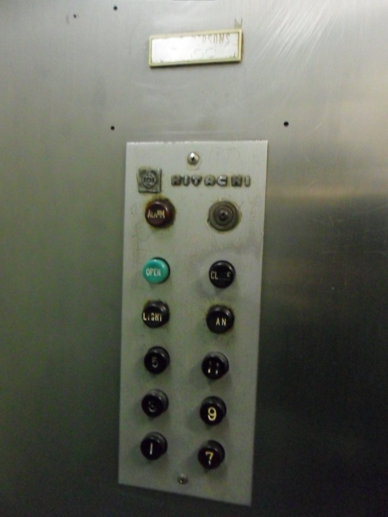 Lift push button panels showing (a) the outside panel with up and down