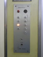 Some of older Mitsubishi elevator may not have a door close button. Notice that they are letterings instead of symbols.