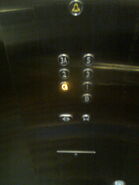 An elevator button panel with fourth floor numbered as "3A".