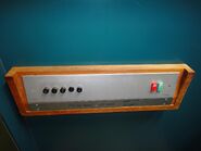 1960s Kone car station with black solenoid buttons.