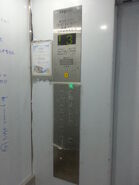 Some of modernized Fujitec elevator car station with square type "Fake Dewhurst" floor buttons and Vander Electronic Technology floor indicator in Hong Kong.