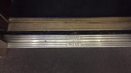 Otis door sill on an elevator from c. 1965 (different hoistway door sill) (two logos on inside, center opening doors)