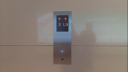 New Mitsubishi flushed hall station with blue illuminating button. (Terminal floor)