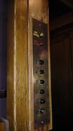 A newer set of HM15 fixtures from 1995, with a black color on a brass panel.