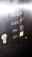 1997 Haushahn door control, fan and alarm buttons in Jakarta, Indonesia. Notice the labels were typed in Indonesian.