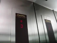 1989 Fujitec Computer Control capacity plate in the United Kingdom.