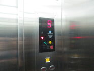 A ThyssenKrupp-rebranded early 2000s Dong Yang floor indicator and capacity badge in Jakarta, Indonesia.