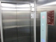 Schindler 3300 AP elevator with two-speed doors.