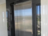 IMG 0595.jpg (2.85 MB) Schindler 3300 AP MRL cabinet installed within the door frame (left side).