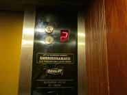 Emergenzamatic notice sign in an Indolift elevator. The text means "This lift is equipped with Emergenzamatic, a safety device in case of power failure."