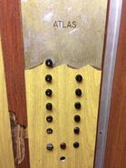 1960s wooden Atlas car station with small black buttons.