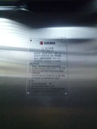 2005 Hong Kong Sigma nameplate and capacity plate with operating reminder.