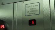 KONE Lifts sign on a Kone hydraulic car elevator.