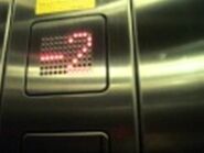 Vandal resistant M-Line S-Series style LED floor indicator with red dot matrix.
