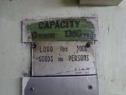 Fiam nameplate in Hong Kong, with Loads and Persons
