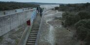 Omar and Ander descend the Bridge of Los Arroyos Reservoir S01E02
