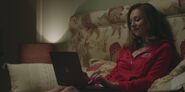 Carla chats with Christian on her laptop S01E02