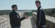 Ander and Christian talking on the Bridge of Los Arroyos Reservoir S01E01