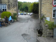 The slip road inbetween the Woolpack and Pear Tree Cottage.