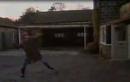 Jock throws a stone through a window in February 1988.