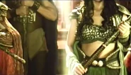(Only a short and small glimpse of Danaya’s descendant beside Alena’s descendant) Just like the rest, Danaya’s descendant wears the same warrior armor as Danaya in Etheria in the teaser only with differences. Danaya’s descendant didn’t get a frontal preview of her armor but as can seen in the aerial view of the five main protagonists, her headgear is Danaya’s tree roots and vines crown in Book 1, she wears a long brown cape and wore Danaya’s wood gauntlets from Book 1.