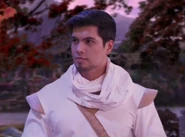 As he first appeared (in the teaser for Episode 209).