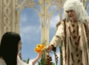 Lira accepts the flower from Dakila.