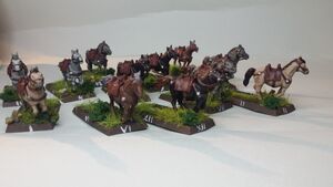12 horses with saddles and place for figurine behind on base, 5 different colurs, numbered