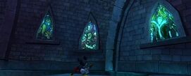 The stained glass windows in the Dark Beauty Castle that reveal Captain Hook, Scar and Maleficent.