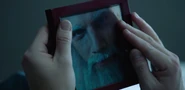 Wolverine holding a picture of EpicLLOYD with Gandalf's beard
