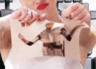 Miley Cyrus ripping a photo of Joan of Arc