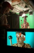 A picture of Shaka Zulu in front of the green screen from Nice Peter's Twitter account