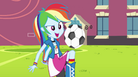 Equestria girl Rainbow Dash playing soccer.